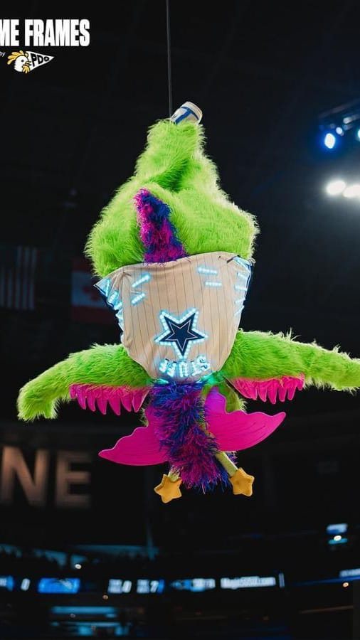 Orlando Magic mascot Stuff hanging upside down in a custom LED star jersey
