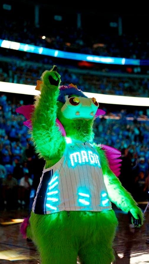 Orlando Magic mascot Stuff raising a fist in a custom LED pinstripe jersey