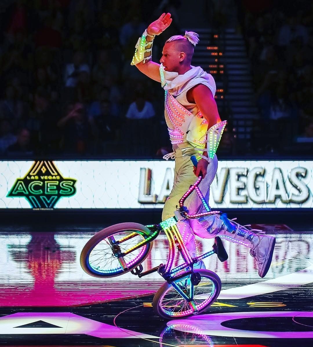 Blake Hicks riding the LED Bike at a Las Vegas Aces halftime