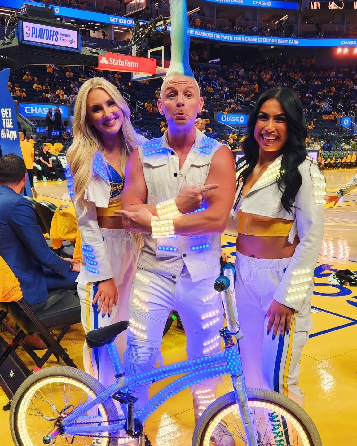 Blake Hicks with Warriors dancers in LED jackets at the NBA Playoffs